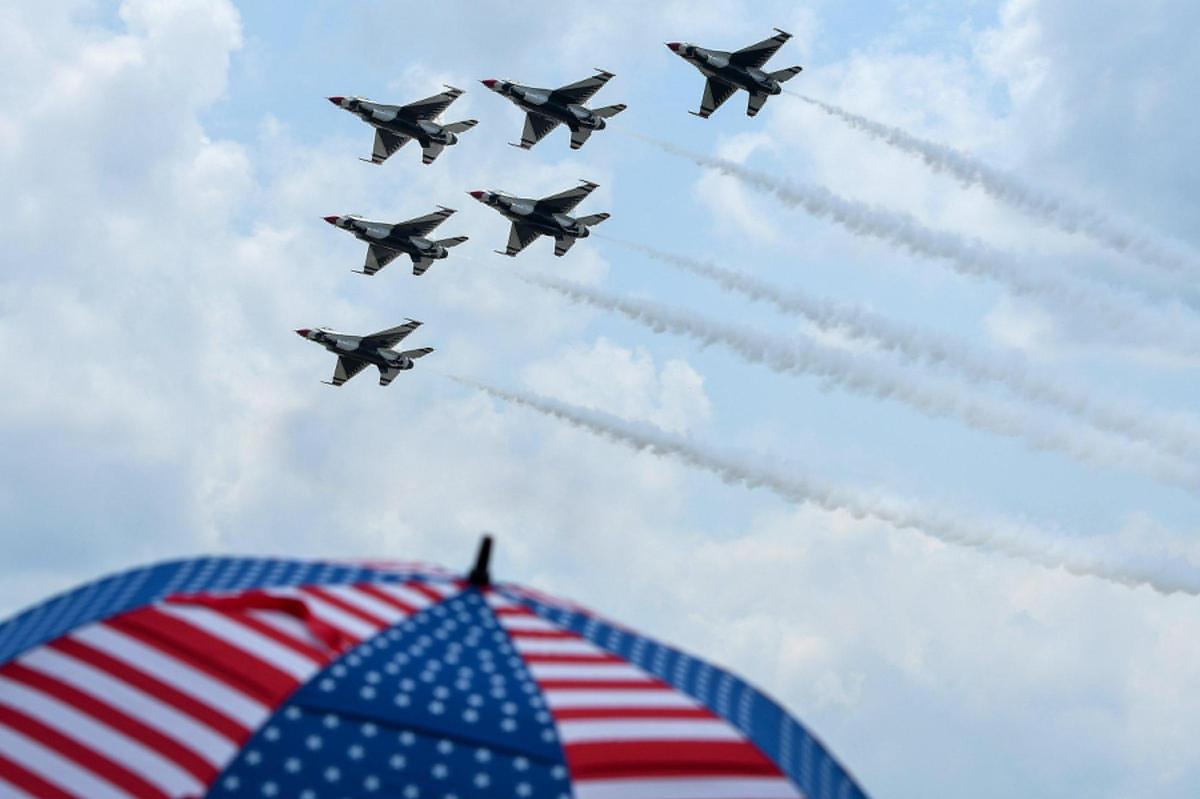 The United States Air Force Thunderbirds flew in formation as on the second and final day of the 2021 Kansas City Airshow at the New Century AirCenter in New Century, Kansas, on the Fourth of July 2021. This year, the Thunderbirds and the Blue Angels performed at the same show, which is rare.