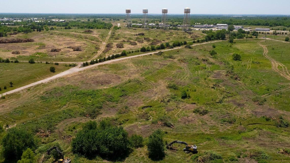 Crews cleared trees recently in an area northeast of the former Sunflower Army ammunition plant in Johnson County. Panasonic plans to build a $4 billion factory there to manufacture batteries for electric vehicles. The plant and four water towers are at top.