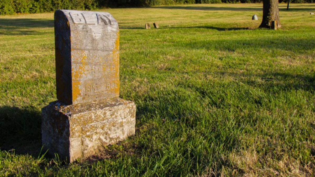 A headstone marks a grave in the “potter’s field” area of Liberty’s Fairview Cemetery where Black people were buried in the 1800s and after.