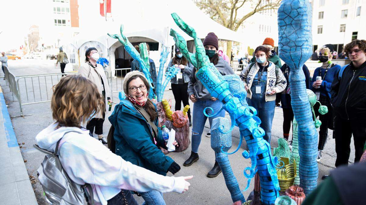 Sarah Nguyen, T/F Art Installations Coordinator, leads Camp True/False students through an art walk of various pieces on 9th Street and in The Picturehouse during 2022’s festival.