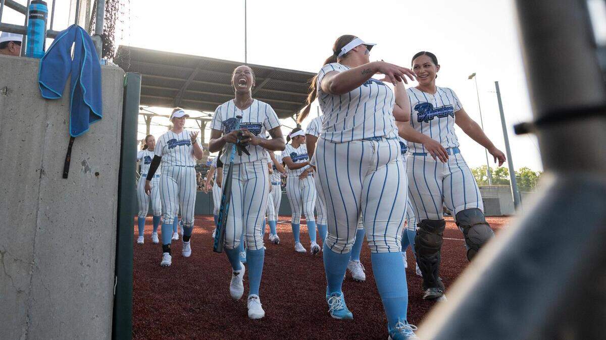The Smash It Vipers celebrate after a Vipers outfielder Katelyn Short hit a home run as the USSSA Pride take on the Smash It Vipers in the inaugural opening day game for the WPF in at the Shawnee Mission Softball Complex in Shawnee KS, on Tuesday June 14, 2022.