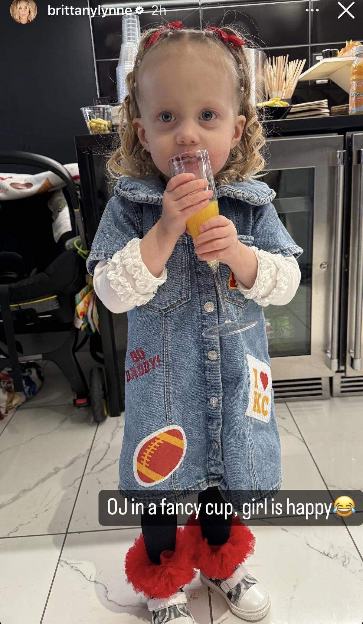 Sterling Mahomes with her Super Bowl orange juice.