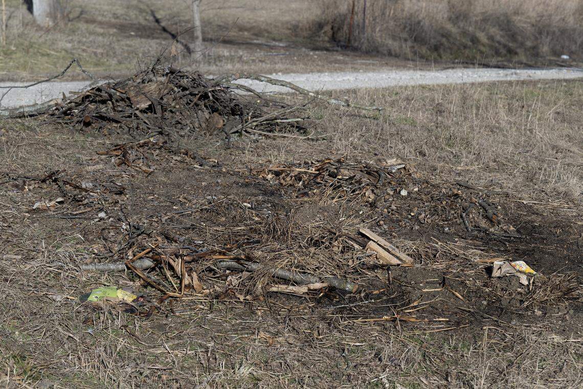 An area of recently burned debris was seen on Monday, Jan. 12, 2026, in the Holiday Lakes area in Pleasanton, Kansas. The area is across the street from the home of Damon B. Leonard. 