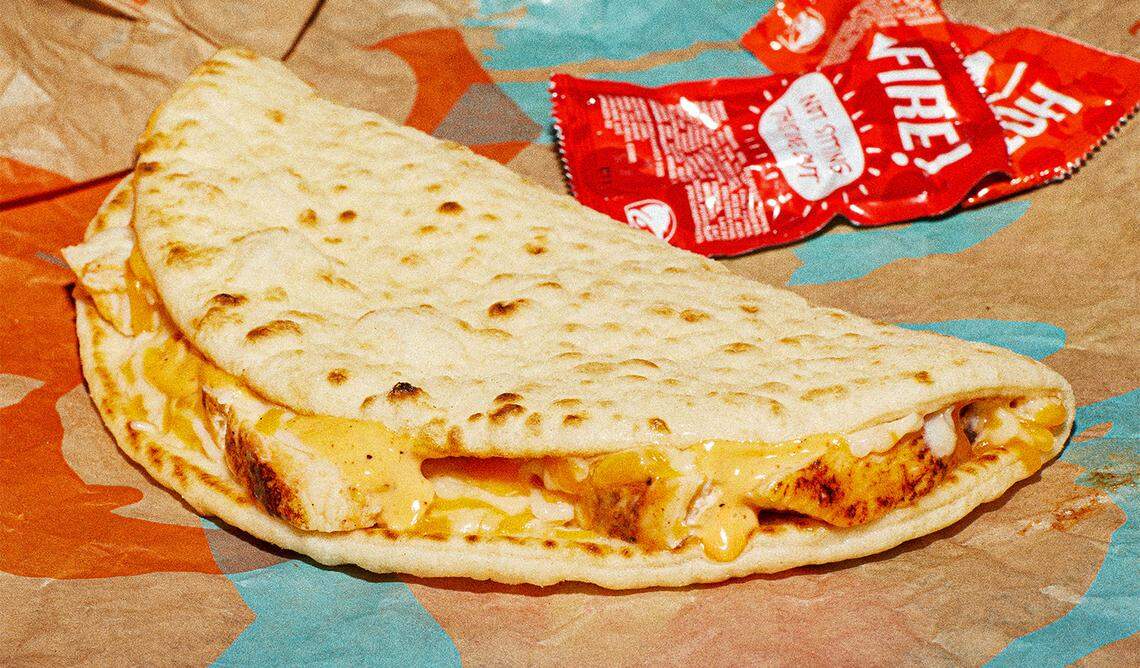 Taco Bell’s new three-cheese chicken flatbread melt arrives on menus nationwide Thursday, Jan. 11.