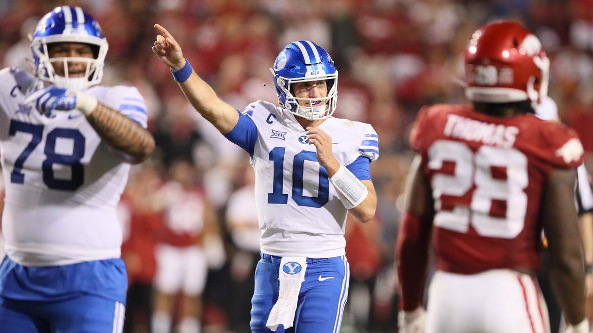 BYU Cougars quarterback Kedon Slovis (10) signals first down during the fourth quarter against the Arkansas Razorbacks at Donald W. Reynolds Razorback Stadium. BYU won 38-31.