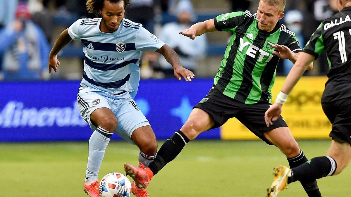 Sporting Kansas City forward Gianluca Busio and Austin midfielder Alexander Ring battle for the ball during Sunday night’s match at Children’s Mercy Park.