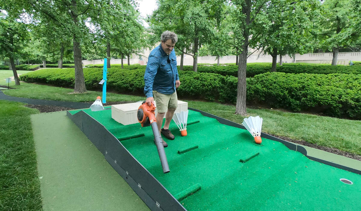 After a busy weekend, James Throckmorton, owner of Small Planet Gardens, blows leaves and does some general upkeeping on hole 9, “Shuttlecocks” at the Art Course, a nine-hole putt-putt golf course at the Nelson-Atkins Museum of Art. Each of the nine holes was inspired by a work of art in the museum’s collection.
