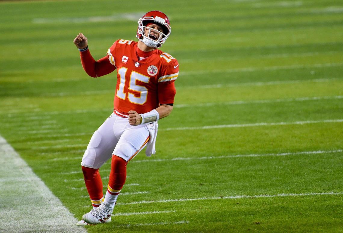 Chiefs quarterback Patrick Mahomes (15) celebrates a short touchdown pass to tight end Travis Kelce during the second-half of the AFC Championship Game Sunday, Jan. 24, 2021, at Arrowhead Stadium in Kansas City. The Chiefs defeated the Bills, 38-24, to head to the Super Bowl.