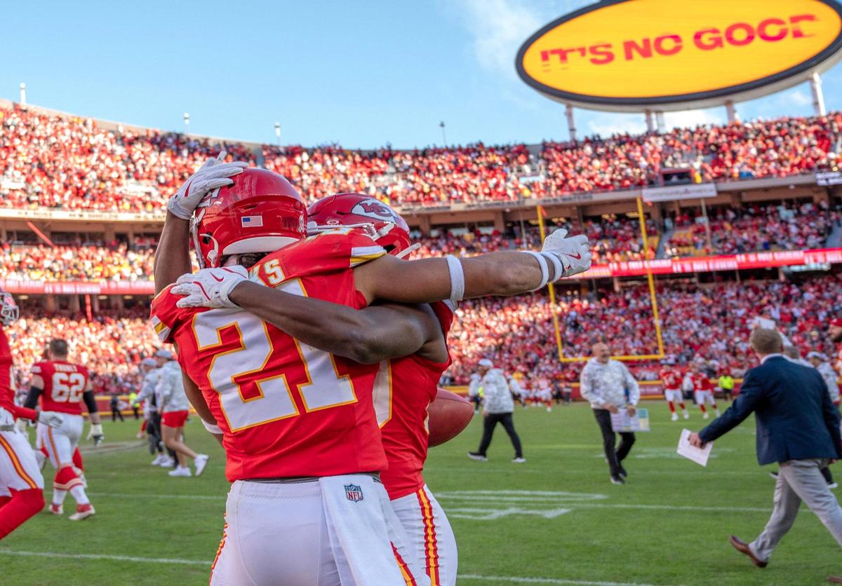 Kansas City Chiefs safety Jaden Hicks (21) embraces cornerback Christian Roland-Wallace (30) after the Chiefs’ 16-14 victory over the Denver Broncos during an NFL game on Sunday, Nov. 10, 2024, at GEHA Field at Arrowhead Stadium.