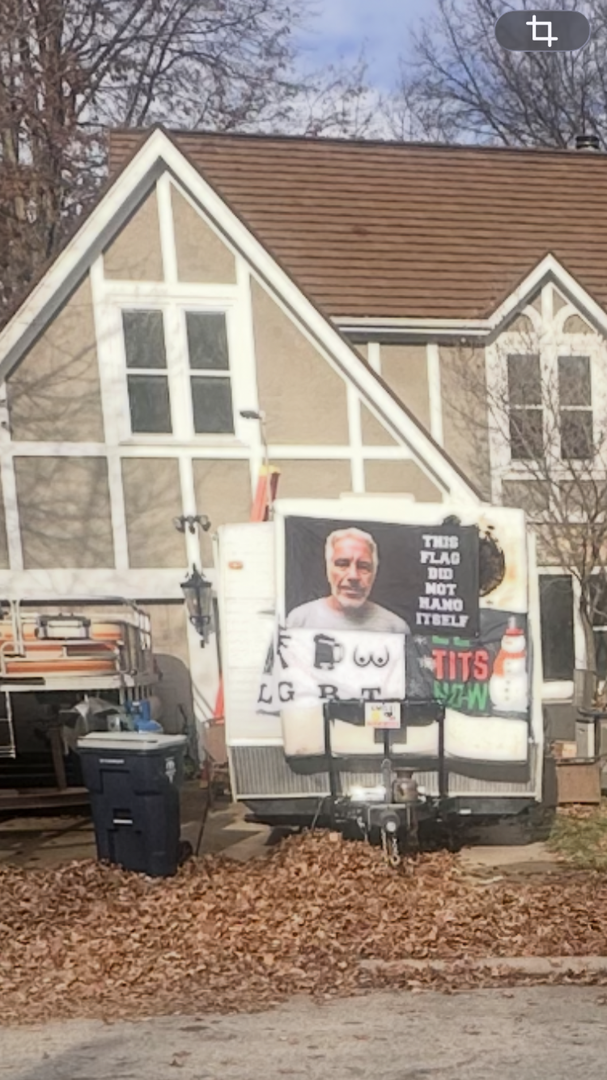 The first of two banners that Jeffrey Traviss King, 42, draped on the back of the R.V. in his driveway in defiance of his neighbors along Northeast 78th Street in the Maple Woods Estates section of Kansas City.