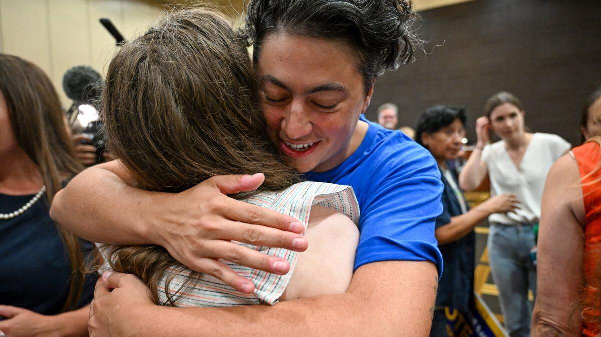 Iman Alsaden, chief medical officer for Planned Parenthood Great Plains, hugged Rachel Sweet, campaign manager for Kansans for Constitutional Freedom, as they celebrated a victory at the polls Aug. 2, defeating a proposed constitutional amendment to remove the right to an abortion.