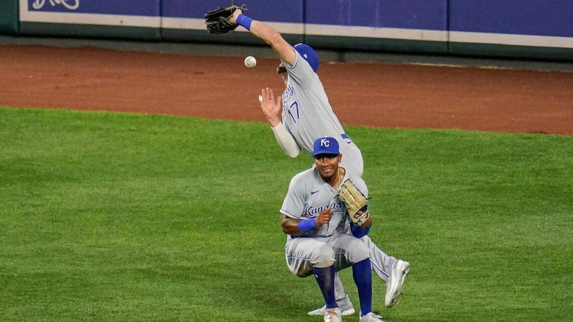 Kansas City Royals right fielder Hunter Dozier, right, collides with center fielder Edward Olivares while going for a fly ball hit by Baltimore Orioles designated hitter Cedric Mullins during the eighth inning Wednesday in Baltimore. The outfielders dropped the ball and two runs scored. The Orioles scored nine in the inning to rally for a 9-8 victory.