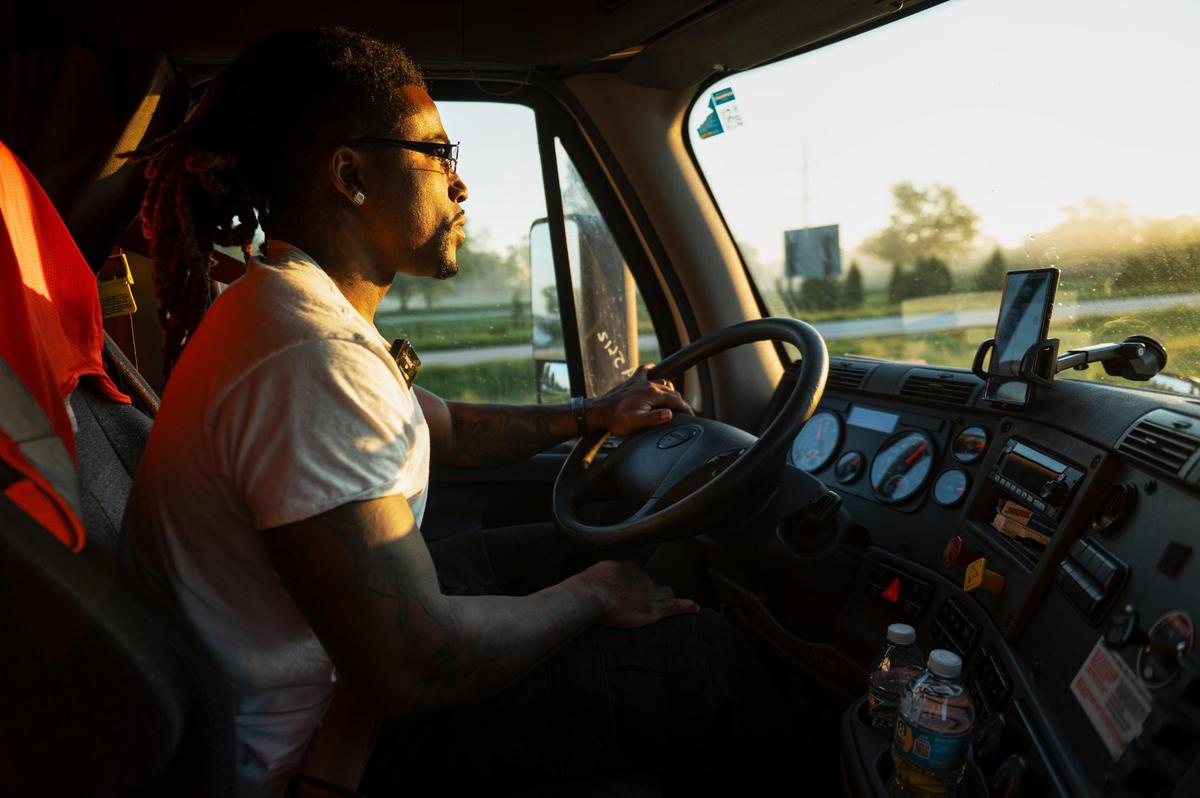 John Roddy drives his semi-trailer truck for an early morning delivery in Kansas City.