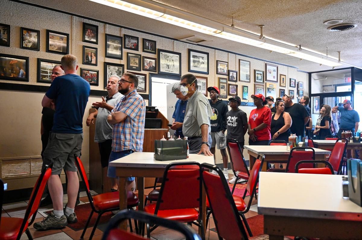 Customers lined up out the door at Arthur Bryant’s Barbeque. It’s operated at 1727 Brooklyn Ave. since 1959, but its roots date decades earlier.