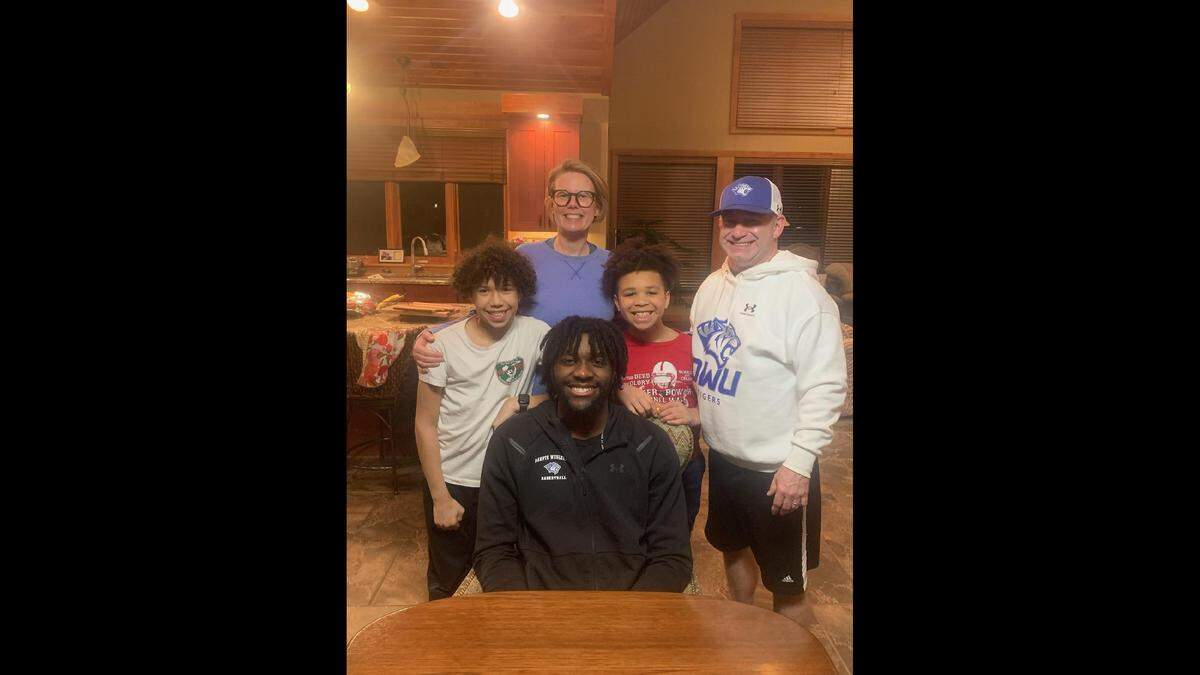 Anthony Riggans is seen with Megan Luther and her family in a submitted photo.