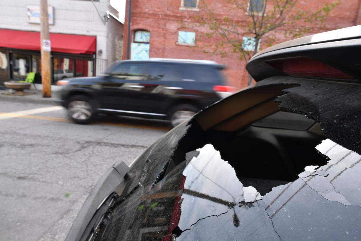 A car window, shattered by gunfire, was visible on Monday morning in the 18th and Vine District in Kansas City. Police said gunfire erupted Sunday in the historic district leaving one man dead and three other adults were injured.