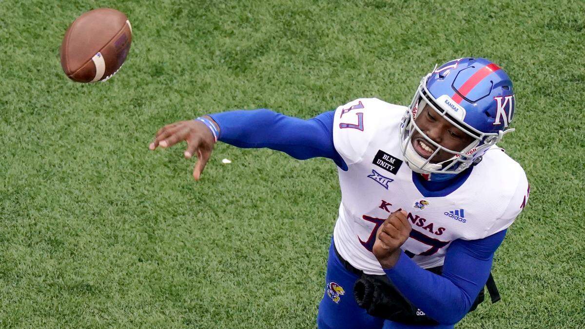 Kansas quarterback Jalon Daniels throws the ball during the second half of an NCAA football game against Kansas State Saturday, Oct. 24, 2020, in Manhattan, Kan. (AP Photo/Charlie Riedel)