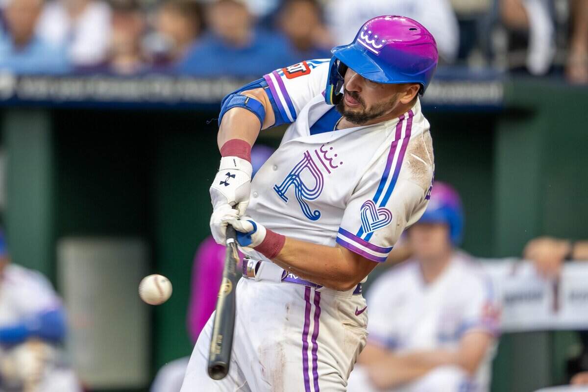 Wearing the Kansas City Royals' new "Forever Fountains" City Connect uniform, first baseman Vinnie Pasquantino (9) hits a single in the first inning against the Houston Astros on Friday, June 12, 2026, at Kauffman Stadium in Kansas City.