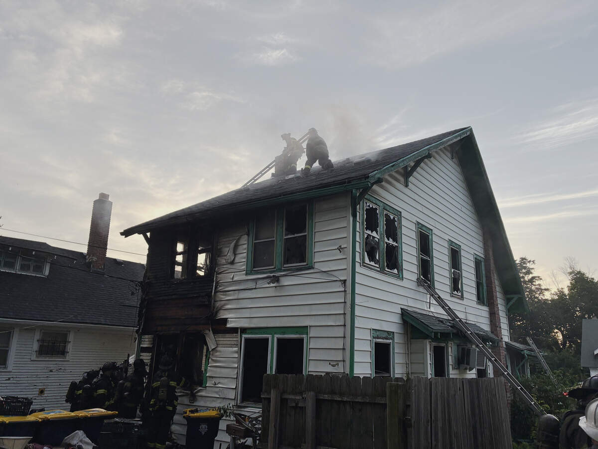 Fire crews extinguished a two-story house fire Tuesday morning in Kansas City’s Palestine West and Oak Park Northeast neighborhood after two people became stranded on the roof. The cause was under investigation.