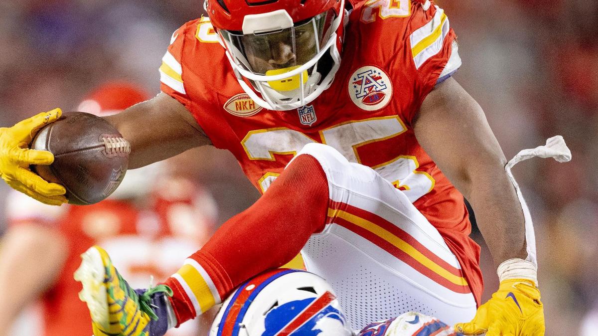 Kansas City Chiefs running back Clyde Edwards-Helaire (25) tries to hurdle Buffalo Bills safety Jordan Poyer (21) during an NFL football game on Sunday, Dec. 10, 2023, in Kansas City.