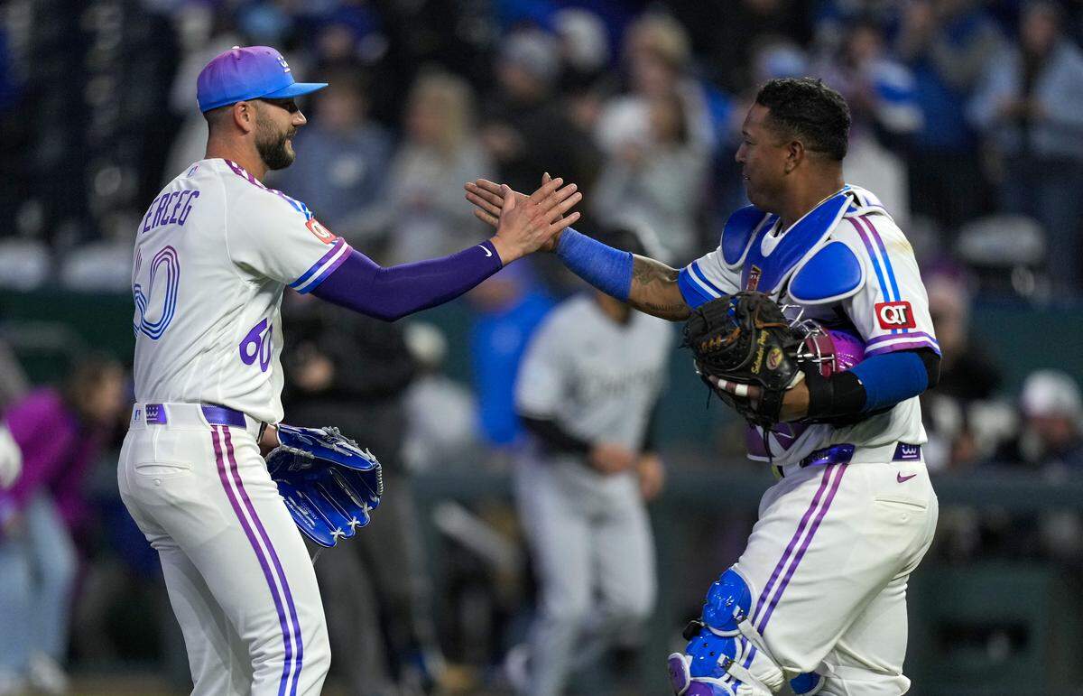 Royals closer Lucas Erceg, left, celebrates a win over the Chicago White Sox with catcher Salvador Perez at Kauffman Stadium in Kansas City on Friday, April 10, 2026.