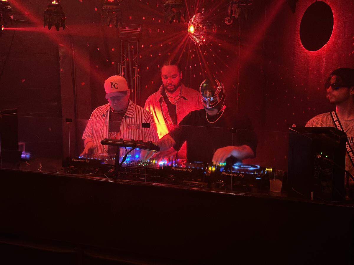 DJs Dom Chronicles, center, and FK Menace, right, perform at now-closed nightclub Kali Sound Room on June 13. Both are inspired by the growth of Kansas City nightlife and hope it continues.
