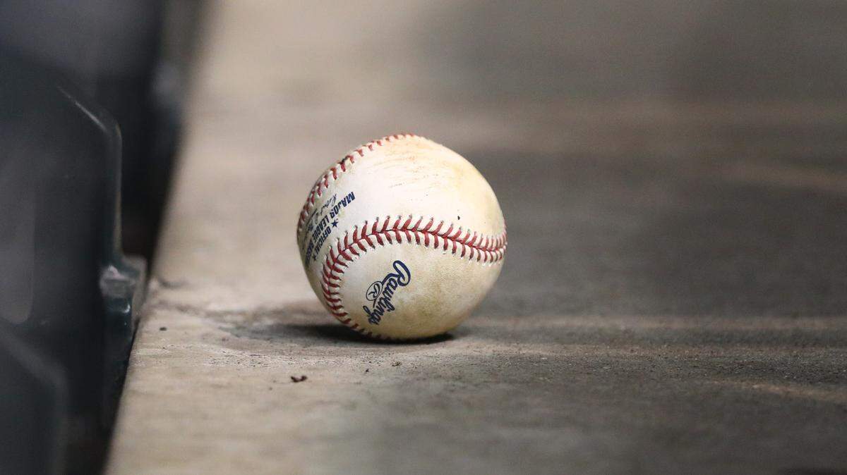 A USA TODAY Sports file photo shows a baseball on an empty row of seats at an MLB game.