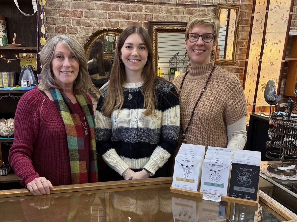 Blue Heron employees (from left) Laurie Riggs, Anna Eulinger and Lisa Winer work together behind the counter at Blue Heron Design.