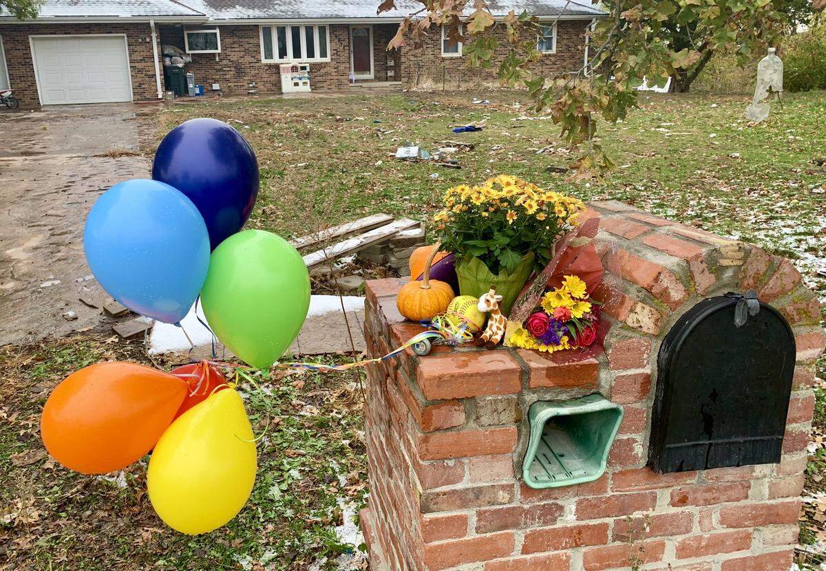 Items were left outside the home of Donald Jackson Jr. on Tuesday, Oct. 27, 2020, in the 14900 block of Hillside Road in Leavenworth, Kansas. It is where authorities days earlier found the bodies of Logan Jackson, 14, and Austin Jackson, 11. 