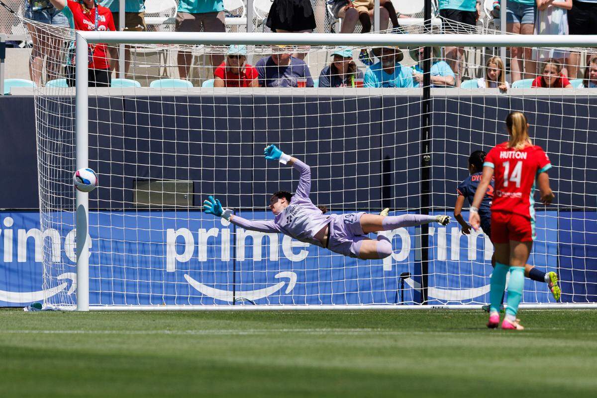 KC Current midfielder Debinha puts one of her two first-half goals into the net past Bay FC goalkeeper Jordan Silkowitz during a National Women’s Soccer League match at CPKC Stadium in Kansas City on Sunday, May 11, 2025.