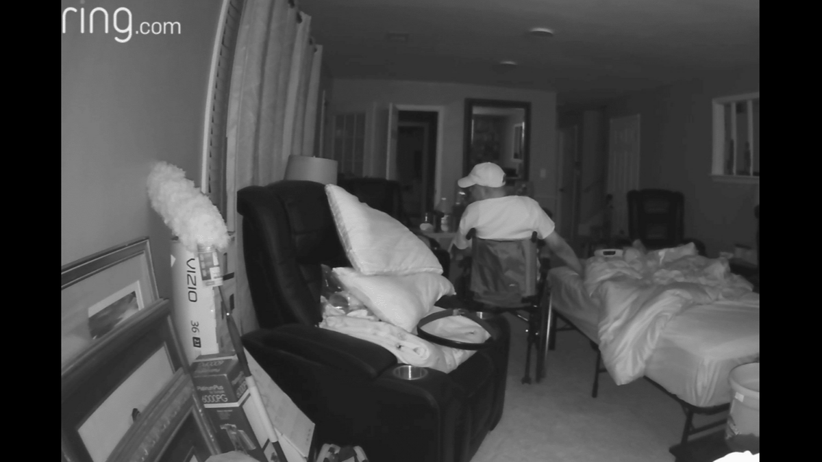 Ring camera footage shows Leroy Blaylock Jr. allegedly concealing a handgun under a blanket as he waits in the living room for Brandi Fields and her mother to return to their Lee’s Summit residence, according to court records and Fields.