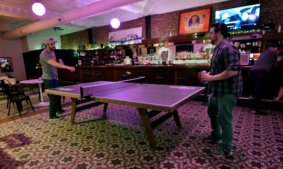 Alex Hiesberger, left, and Joseph Fitch wandered in late on a recent Saturday night for a game of pingpong.