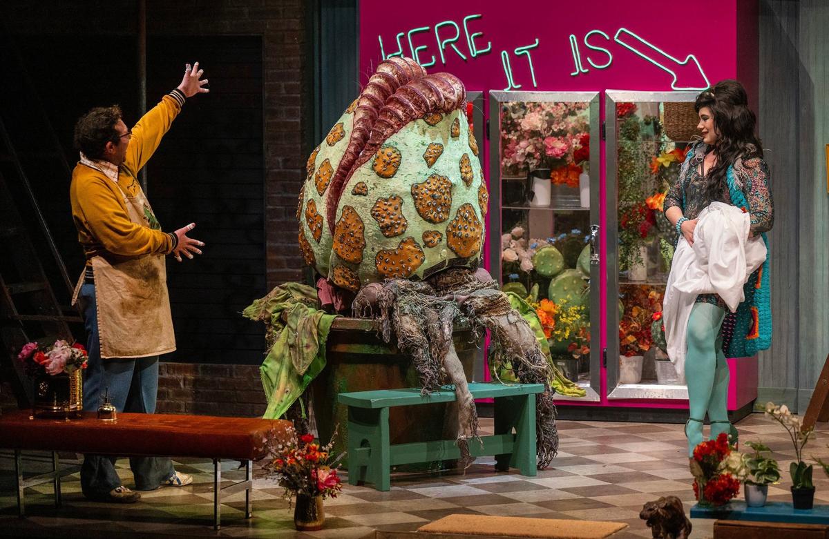 Jordan Matthew Brown as Seymour and Chloe Castro-Santos as Audrey perform on stage during the final dress rehearsal for “Little Shop of Horrors.”
