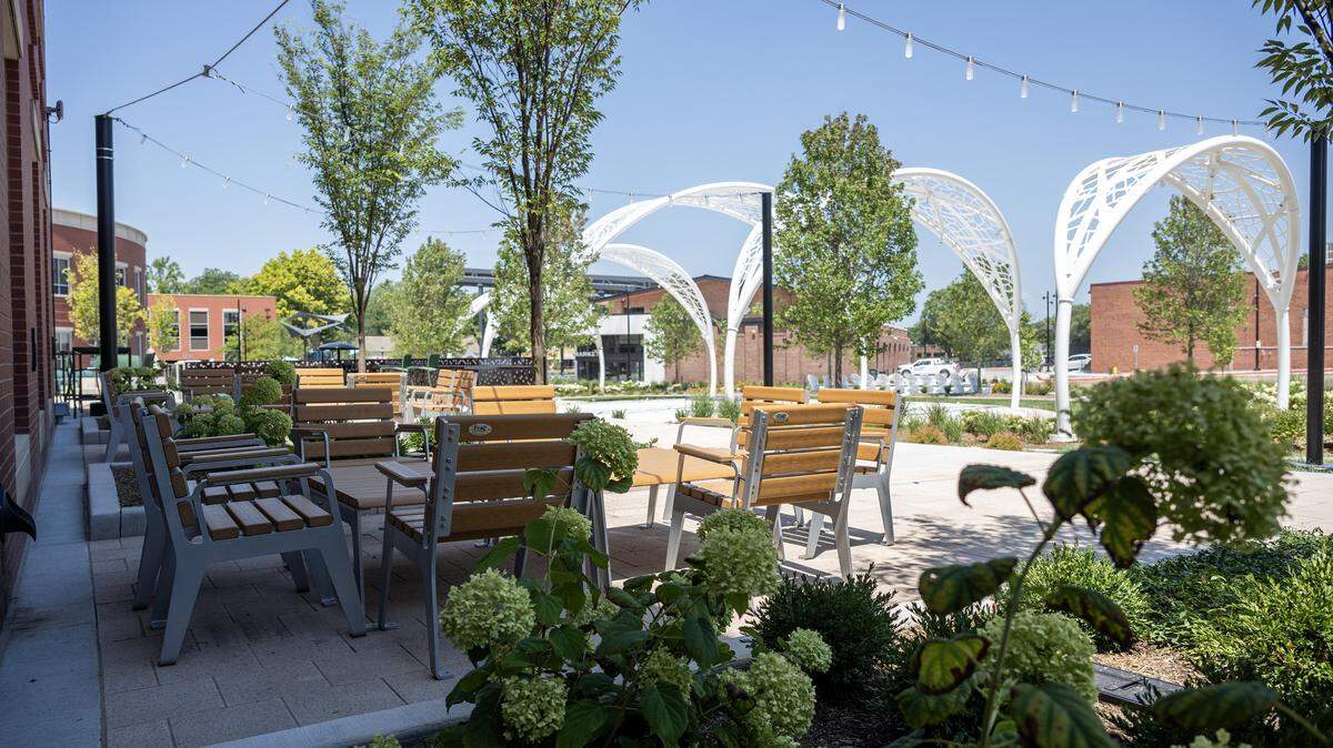 A view of the landscaping and structural arches at the Green Street development is seen from a nearby seating area on Tuesday, Aug. 5, 2025, in Lee's Summit.