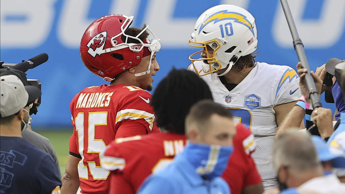 Kansas City Chiefs quarterback Patrick Mahomes (15) and Los Angeles Chargers quarterback Justin Herbert (10) chat after an NFL football game, Sunday, Sept. 20, 2020, in Inglewood, Calif. (AP Photo/Peter Joneleit)