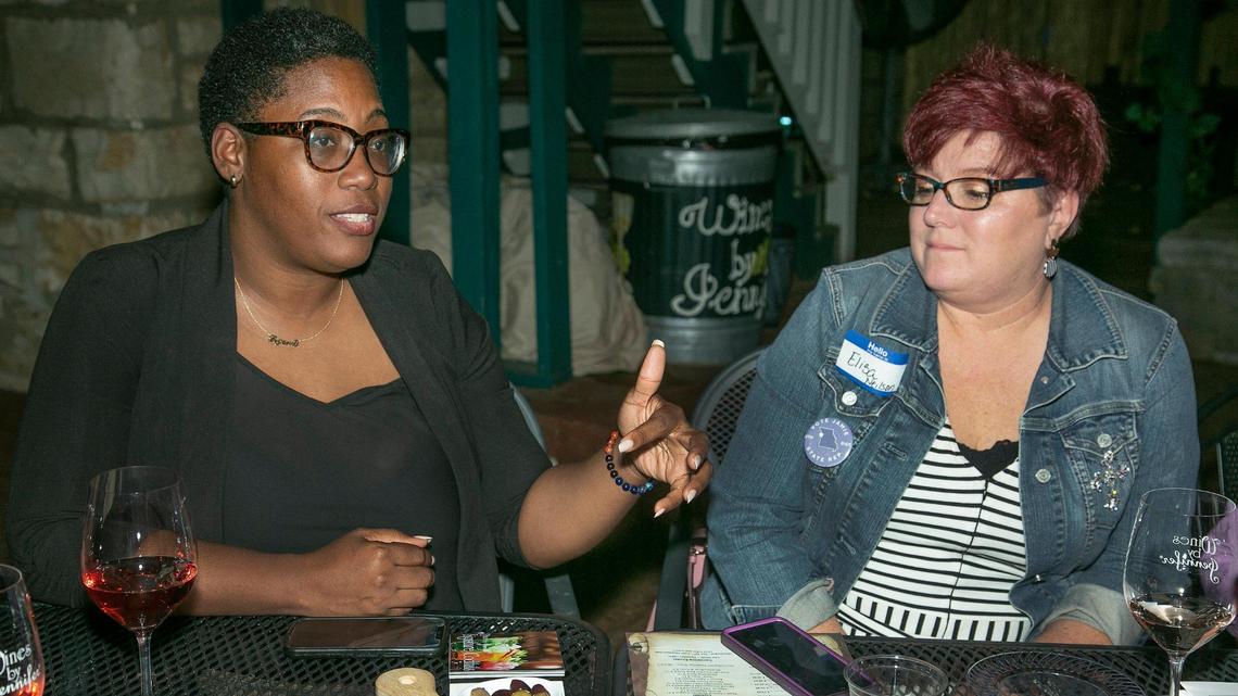 Jamie Johnson, left, Democratic candidate for District 12 of the Missouri House of Representatives, visited with Elisa Neilson during an October campaign event at Wines by Jennifer in Parkville.
