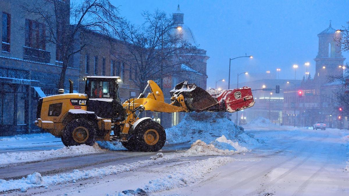 Several trucks cleared the streets in and around the Country Club Plaza during a winter storm in February 2022. The intense snow started falling shortly before 5 a.m. and was expected to continue to for several hours. Heavy snowfall was expected through noon, according to the National Weather Service in Kansas City.
