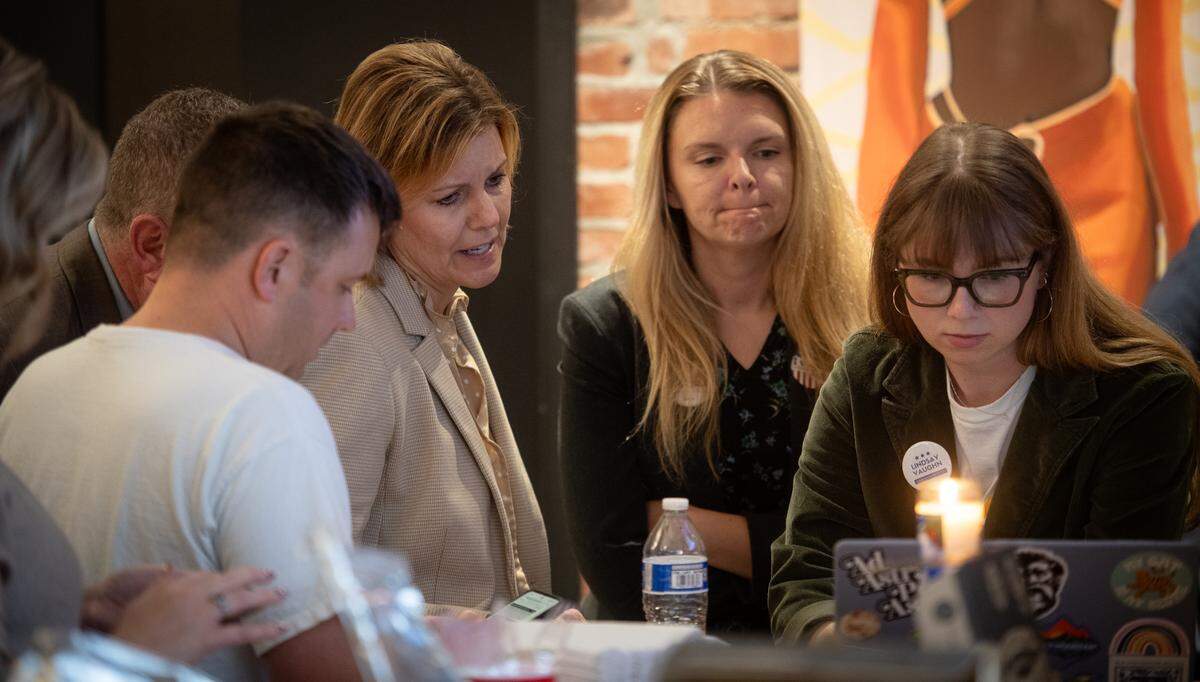 Johnson County Democratic Party candidate for district attorney Venessa Riebli, third from right, looks at election results during an election night watch party Tuesday, Nov. 5, 2024, in Overland Park.