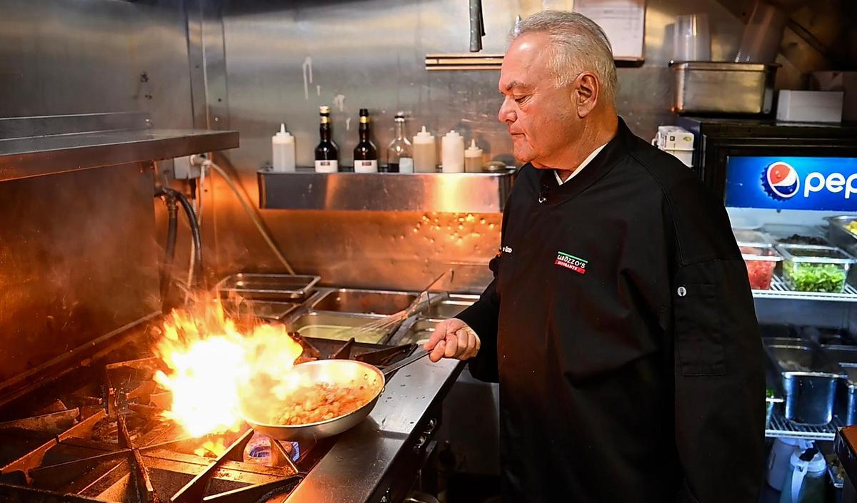 Mike Garozzo cooks a dish of Cavatelli Catania at his Columbus Park restaurant.