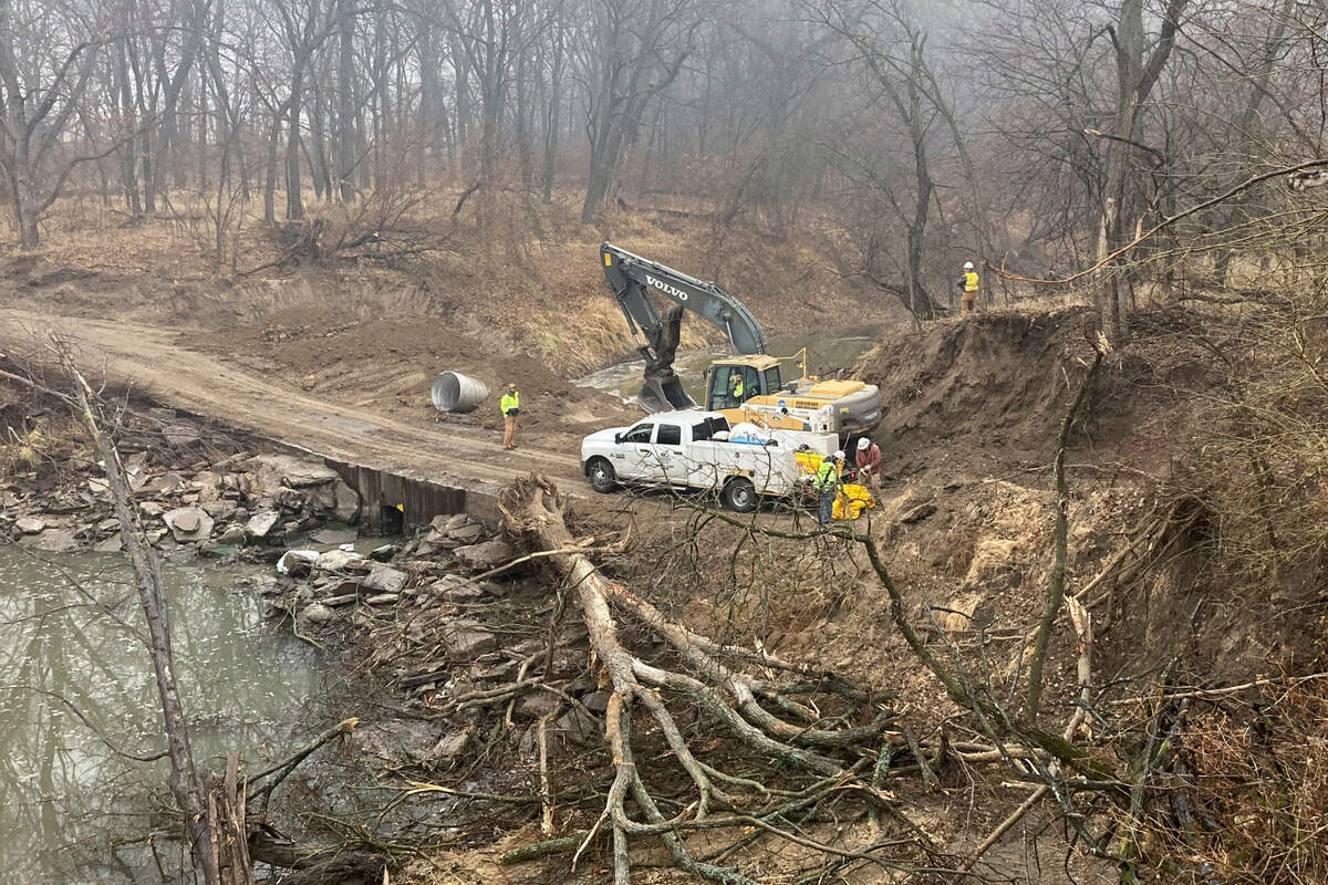 Washington County Road Department constructs an emergency dam to intercept an oil spill after a Keystone pipeline ruptured at Mill Creek in Washington County, Kanas, on Thursday, Dec 8, 2022. Vacuum trucks, booms and an emergency dam were constructed on the creek to intercept the spill.
