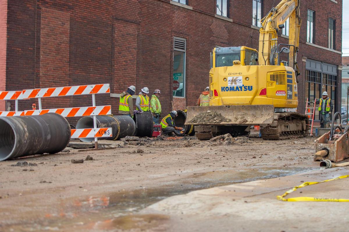 Crew members from Kissick Construction work to repair a 30-inch water main break on Saturday, Dec. 31, 2022, in Kansas City. The main broke Friday night near the corner of Walnut Street and East 17th Street when a vehicle struck a fire hydrant.
