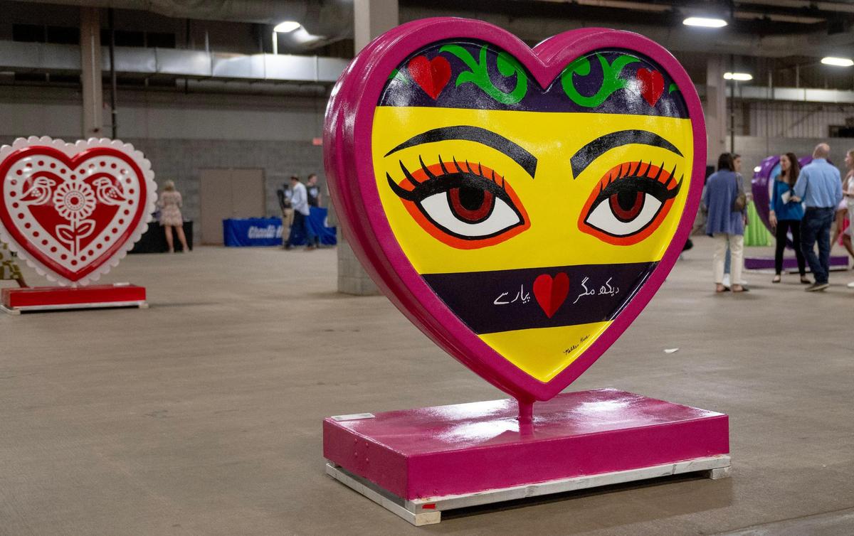 “Look, But Only With Love” by artist Maliha Khan is one of 40 hearts that make up the 2023 season of The Parade of Hearts.