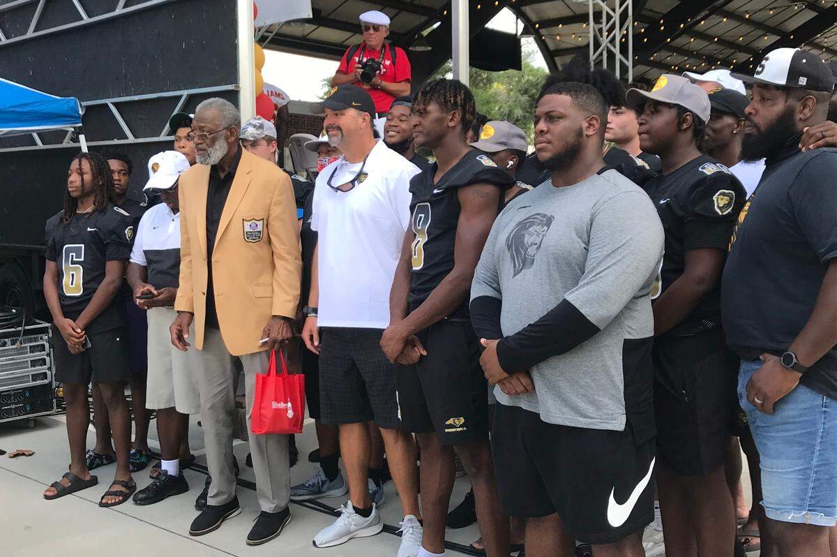 Kansas City Chiefs great Bobby Bell, at left, wearing his Pro Football Hall of Fame jacket, returned to his hometown of Shelby, North Carolina for Bobby Bell Day on Saturday, Aug. 28.