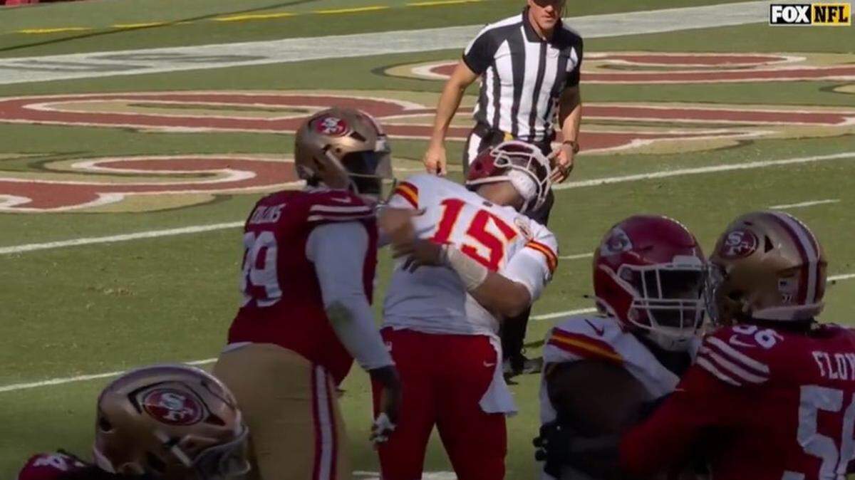 Patrick Mahomes reacted after being hit in the throat.