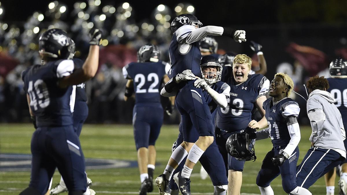 Lee’s Summit West players celebrated after defeating Liberty North 21-13 at LS West in a district playoff game on Friday.