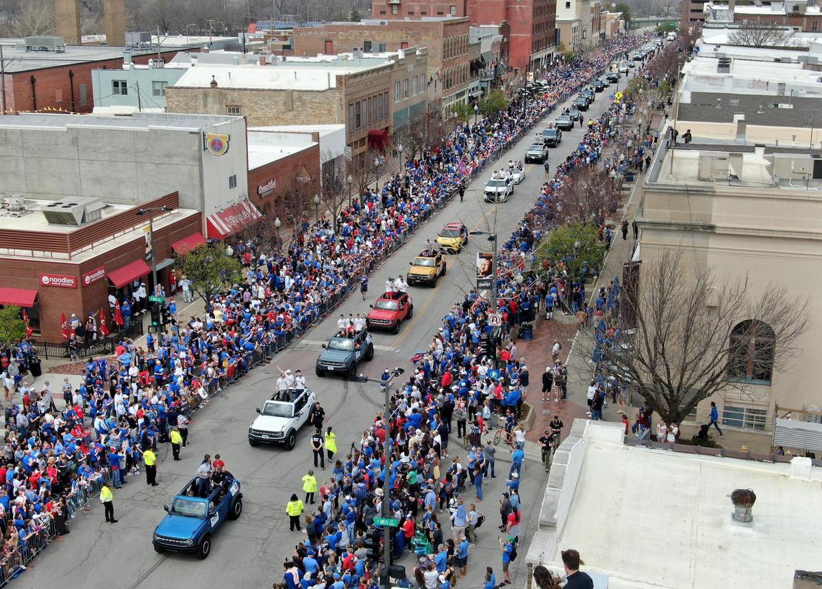 Thousands of fans gathered along Massachusetts Street in downtown Lawrence Sunday, April 10, 2022, to celebrate the Kansas Jayhawks men’s basketball team, the 2022 NCAA champions.