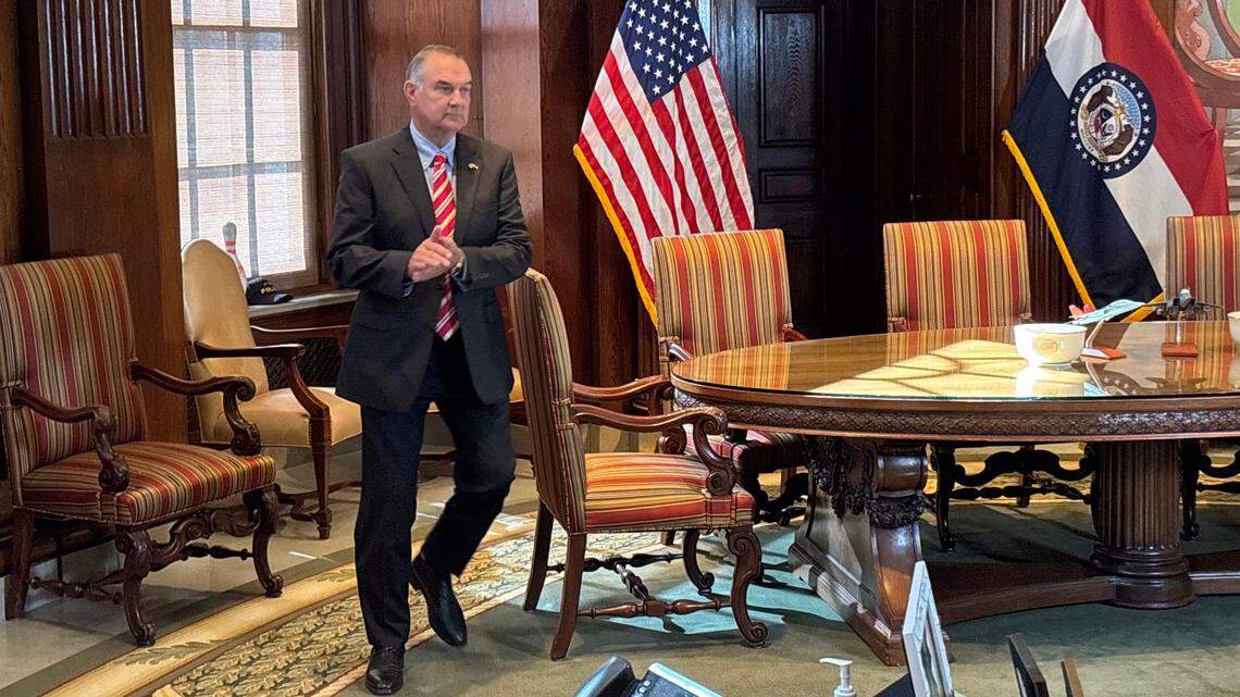 Missouri Gov. Mike Kehoe walks up to a lectern before a news conference at the governor’s office in Jefferson City in May 2025.