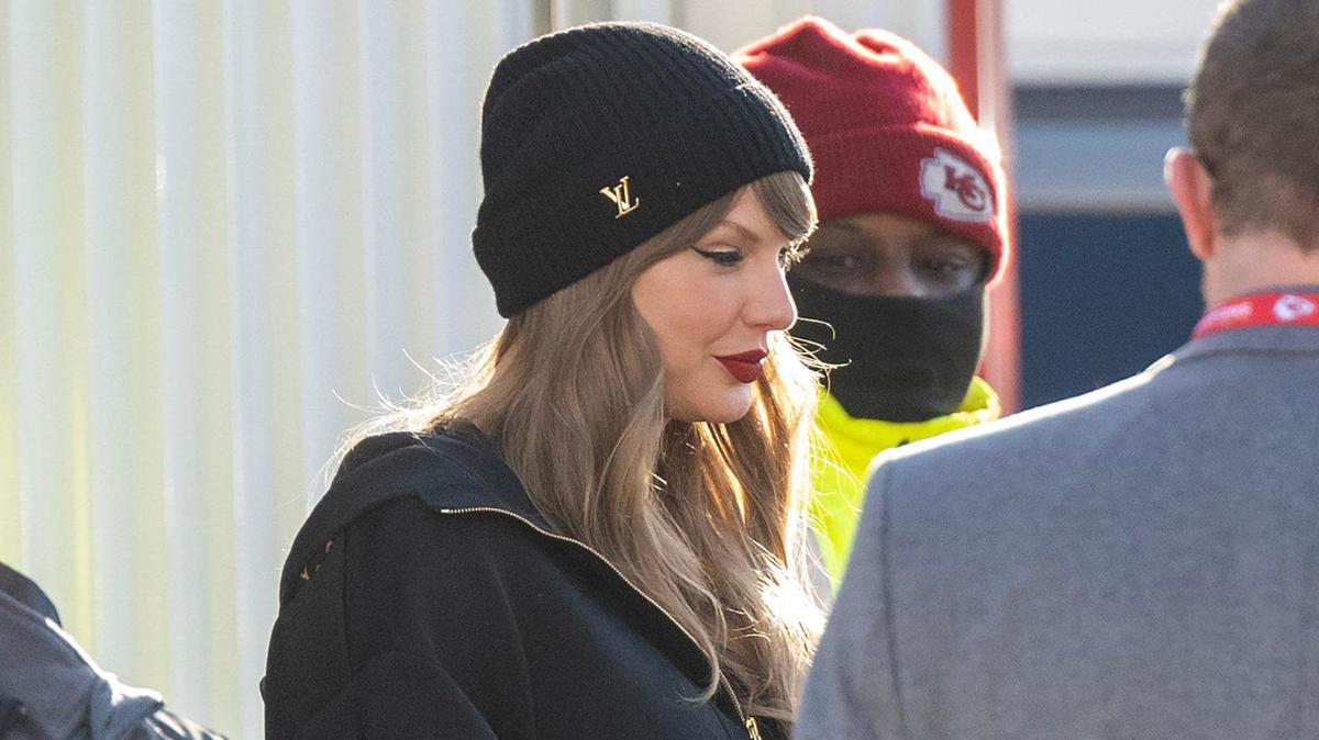 Pop star Taylor Swift is escorted by security as she arrives at the AFC Championship Game between the Kansas City Chiefs and the Buffalo Bills on Sunday at GEHA Field at Arrowhead Stadium.
