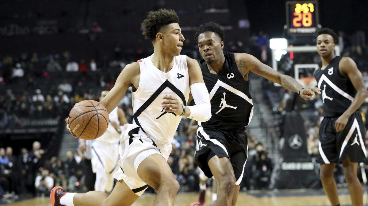 Quentin Grimes (left), who has signed to play at Kansas, had 15 points and nine assists in the Jordan Brand Classic on Sunday in Brooklyn, N.Y.