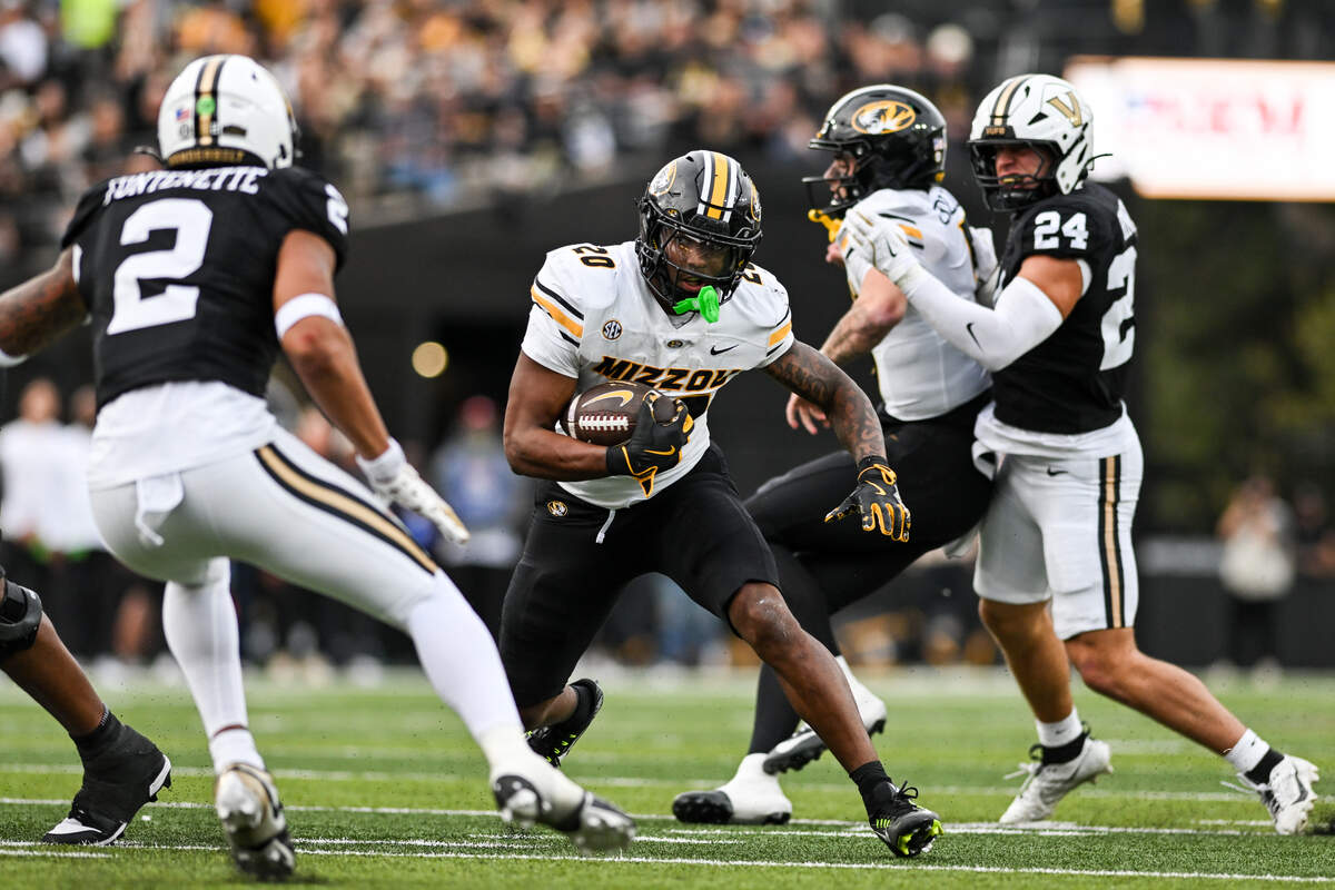 Jamal Roberts #20 of the Missouri Tigers runs the ball against the Vanderbilt Commodores in the second half at FirstBank Stadium on October 25, 2025 in Nashville.